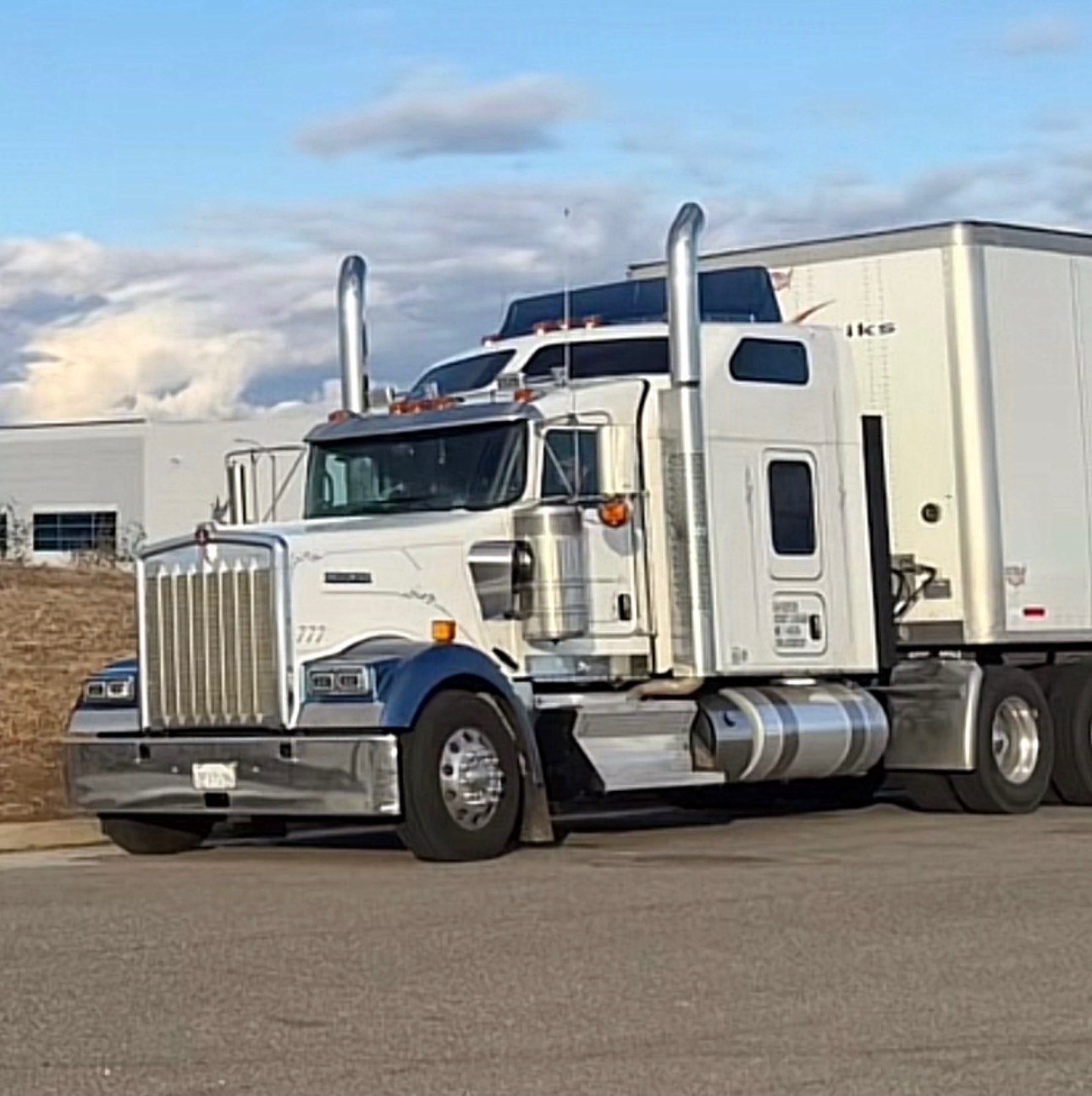 Misa Transportation white Kenworth tractor with white dry van trailer